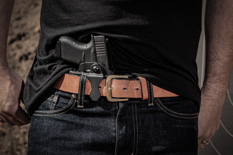 Man at the range wearing a Safariland 575 slim IWB holster