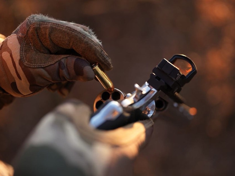 Reloading Colt Revolver with a optic mounted.