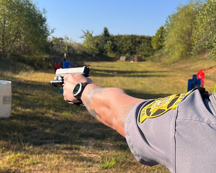 Firing a Glock 17 on the range.