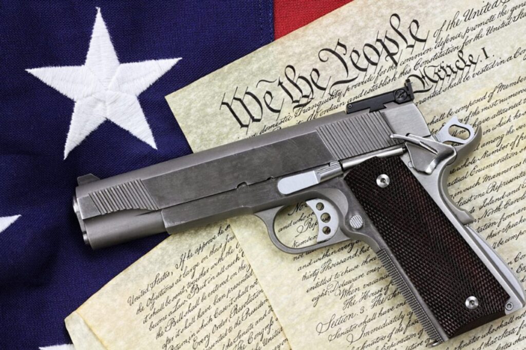 1911 Pistol with the Constitution and American flag