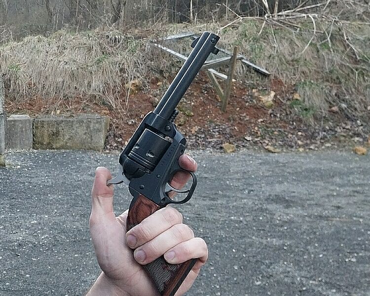 Man holding a Ruger Wrangler revolver