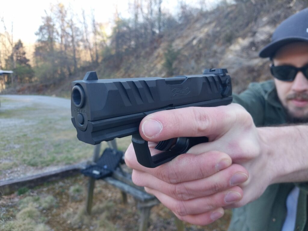 Man firing Walther PD380 pistol