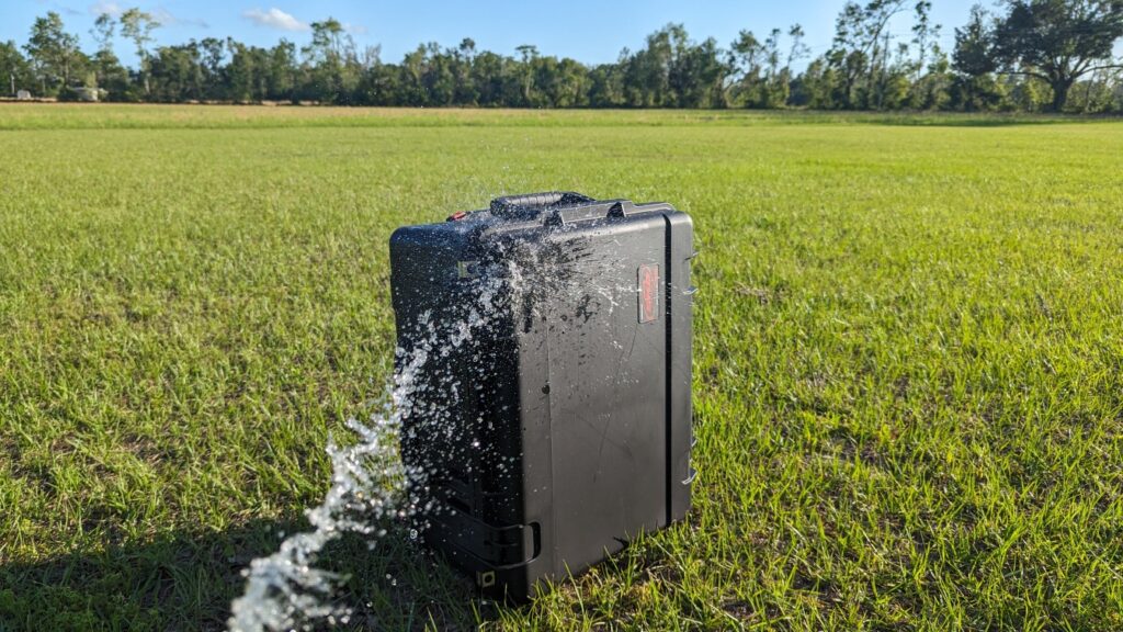 spraying handgun case with water