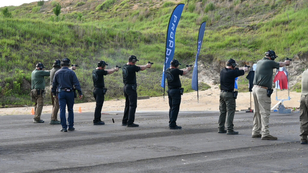 This is a picture of students on the firing line with Propper banners in the background 