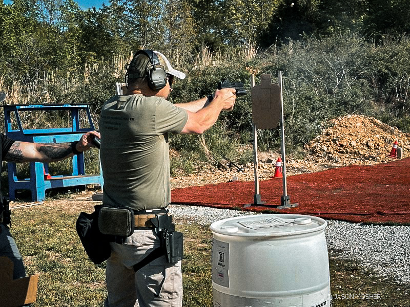 man running handgun drills on the firing range.