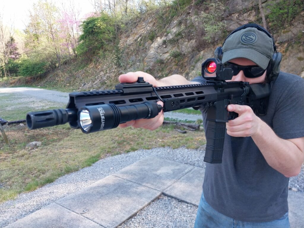 Man with an AR-15 rifle and Nightstick LGL0160 weaponlight