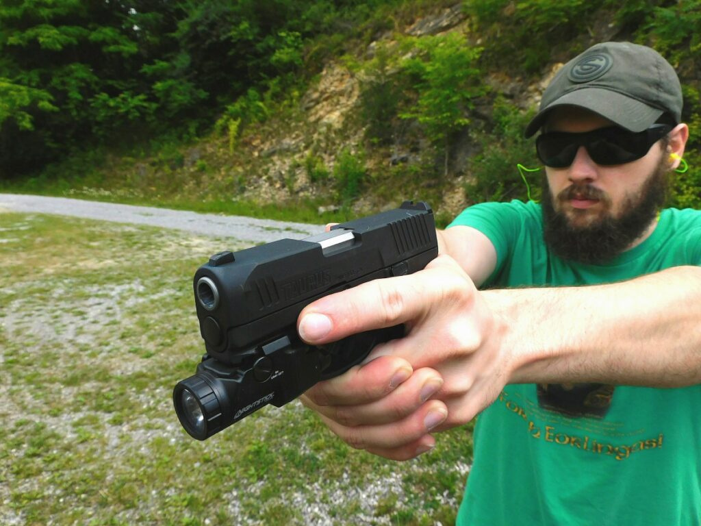 Man shooting a Taurus G3X pistol