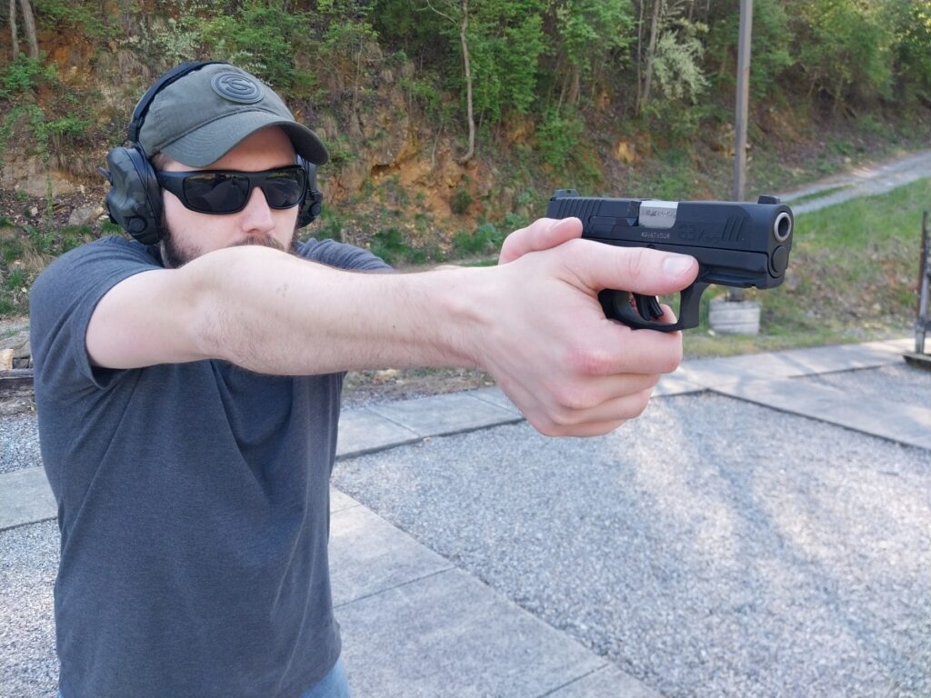 Man firing a Taurus G3X pistol