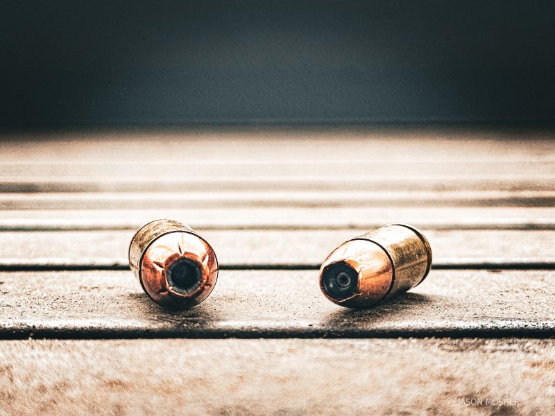 .40 S&W cartridge and 9mm cartridge