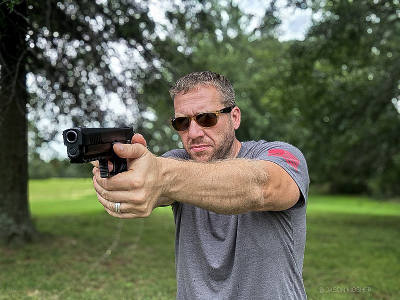 Shooting a 10mm handgun.