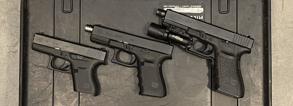 Line-up of Glock pistols with micro-compact, compact, and full-sized models