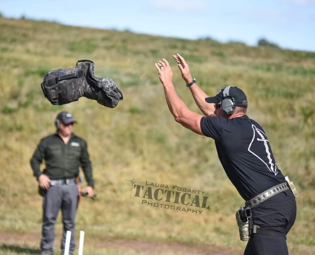 law enforcement officer throwing a sandbag during a War HOGG Tactical training course