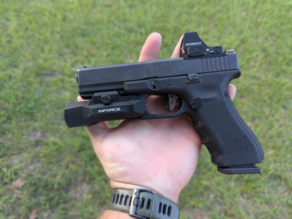 Inforce wild2 weaponlight on handgun in hand