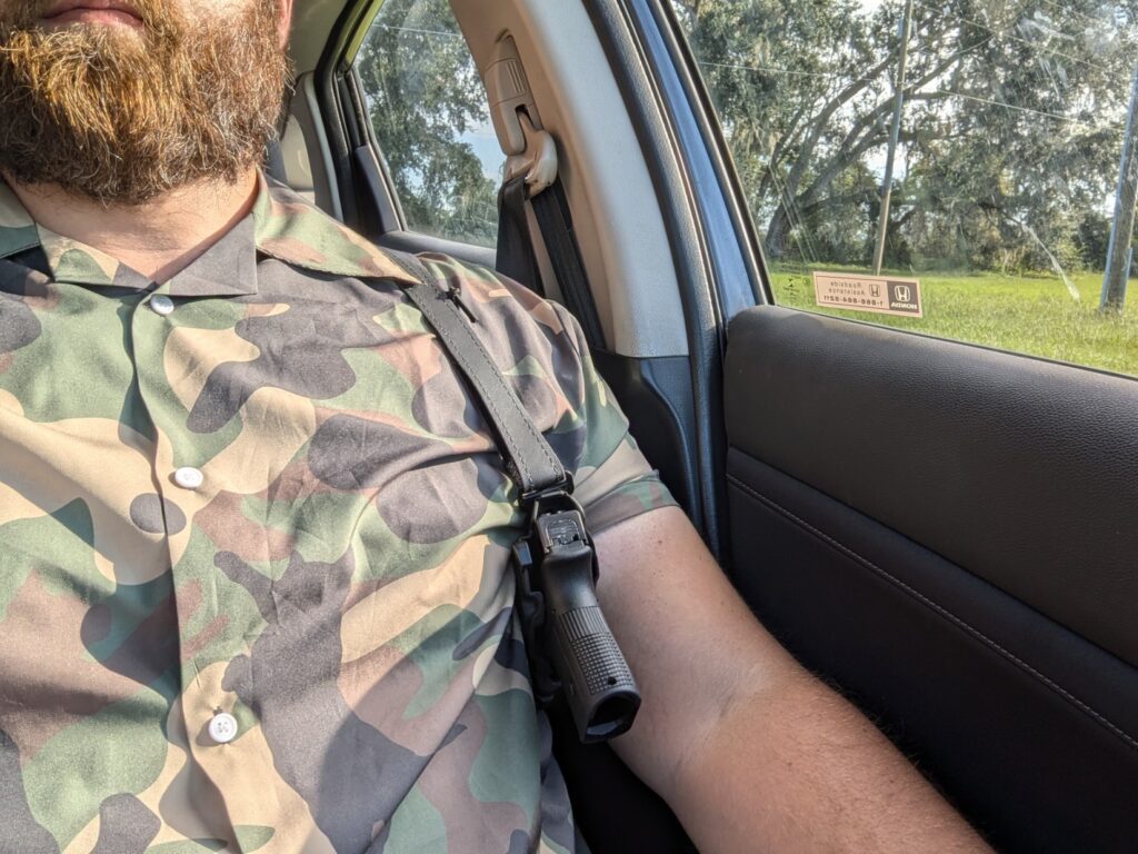 Shoulder holster in car