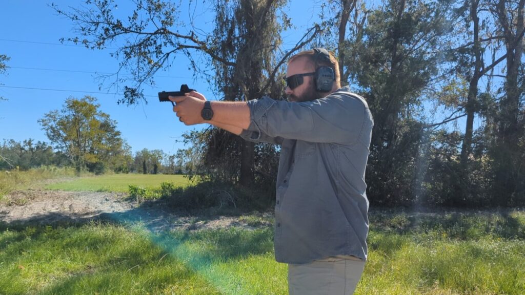 man shooting handgun