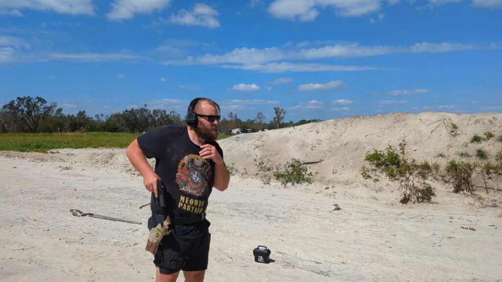 man drawing glock 17 from holster