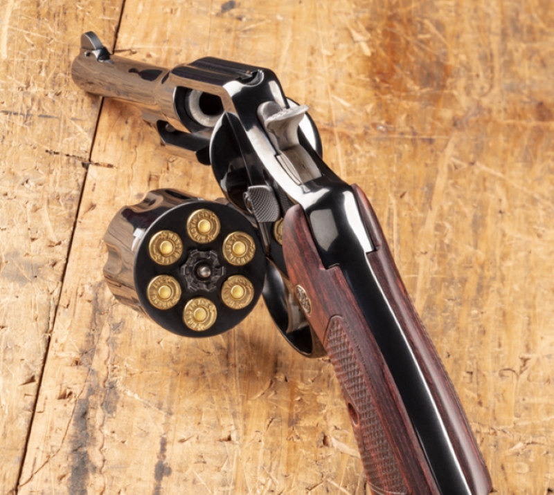 Smith & Wesson Model 20 with cylinder out and loaded.
