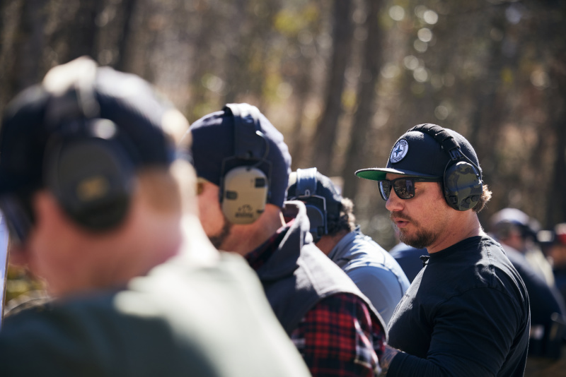 Kyle Morgan instructing students at outdoor range