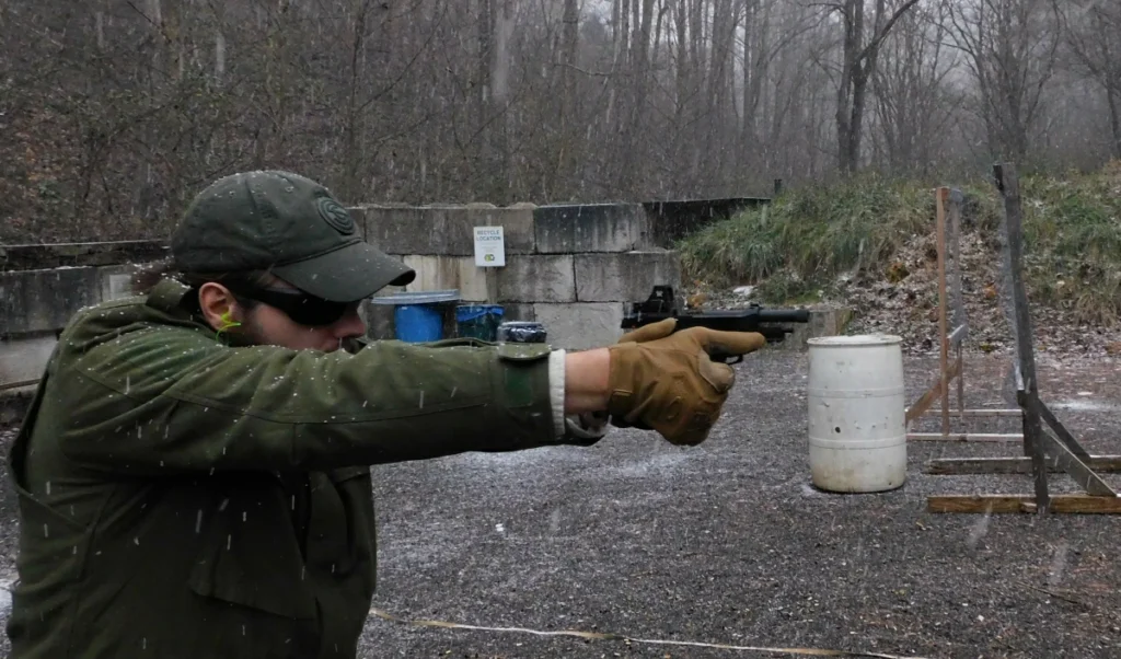 man firing a pistol on the range