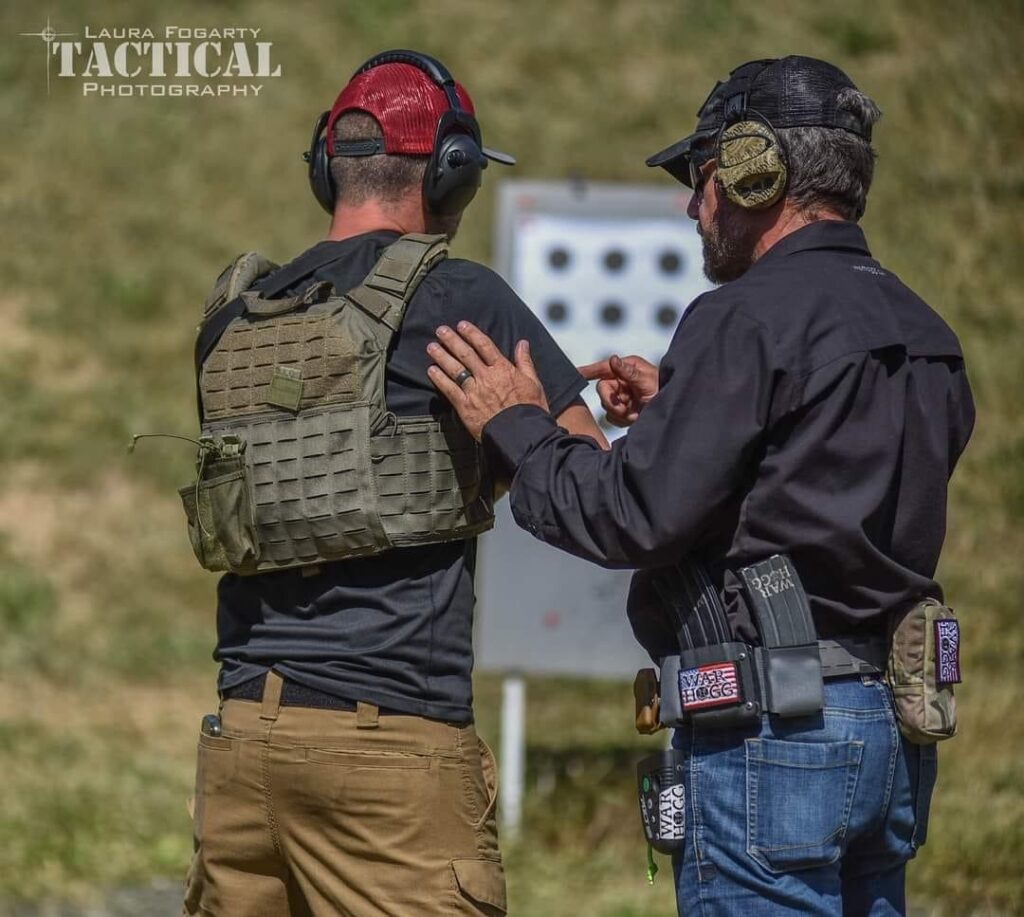 Rick Hogg of War HOGG Tactical coaches a law enforcement officer student during a carbine training course