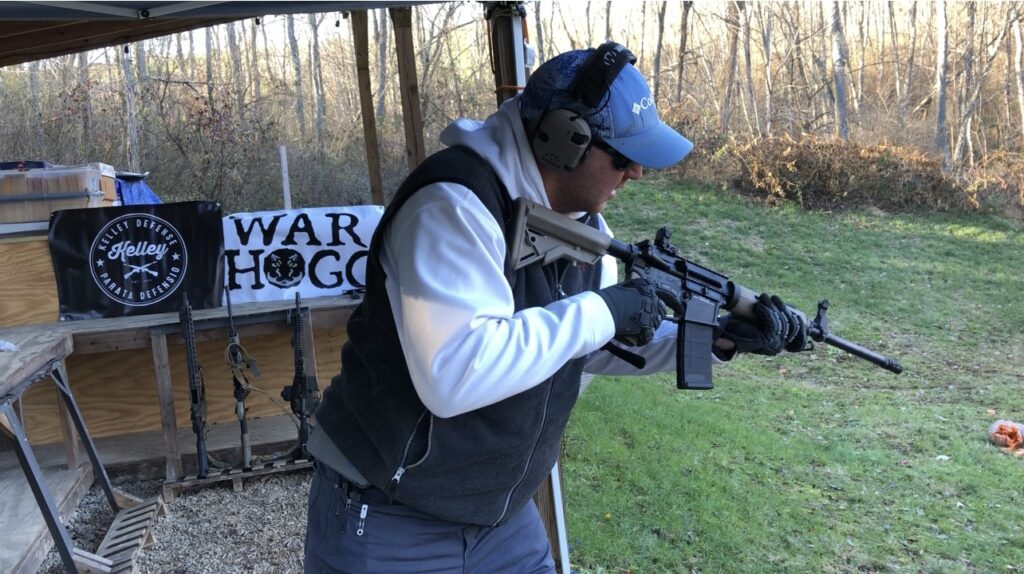 A student takes a look at the ejection port of his carbine for the carbines status during a War HOGG Tactical course