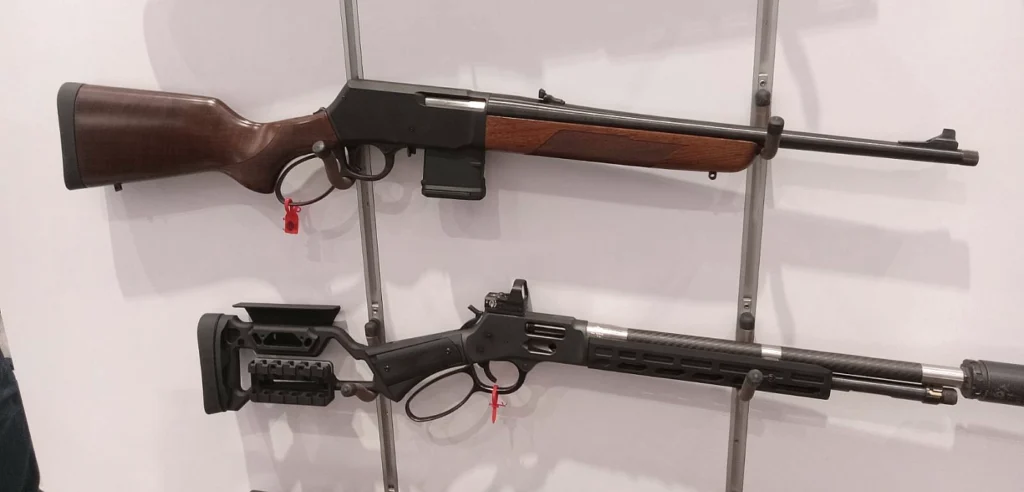 Henry Lever Action Supreme rifle with a Henry X Series rifle