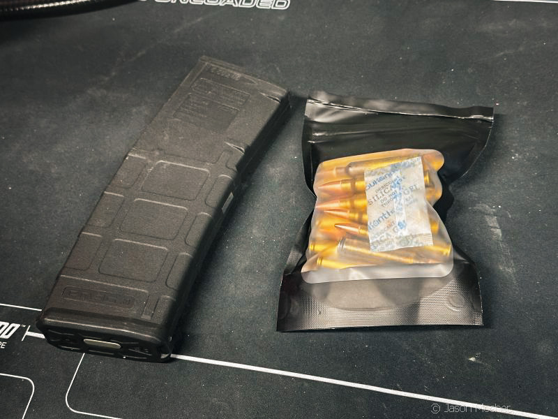 AR mag and bag of ammo.