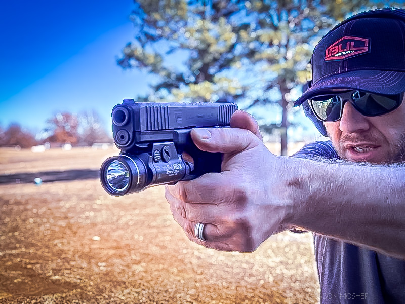 man shooting a glock 17 with Streamlight TLR-1 HL-X