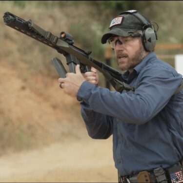The picture is a link to watch Rick Hogg of War HOGG Tactical conduct a tactical magazine change with a carbine
