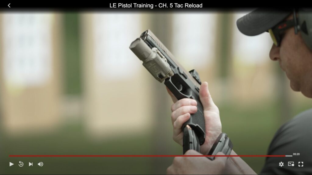 This tactical magazine change photo is a link to watch an instructional video