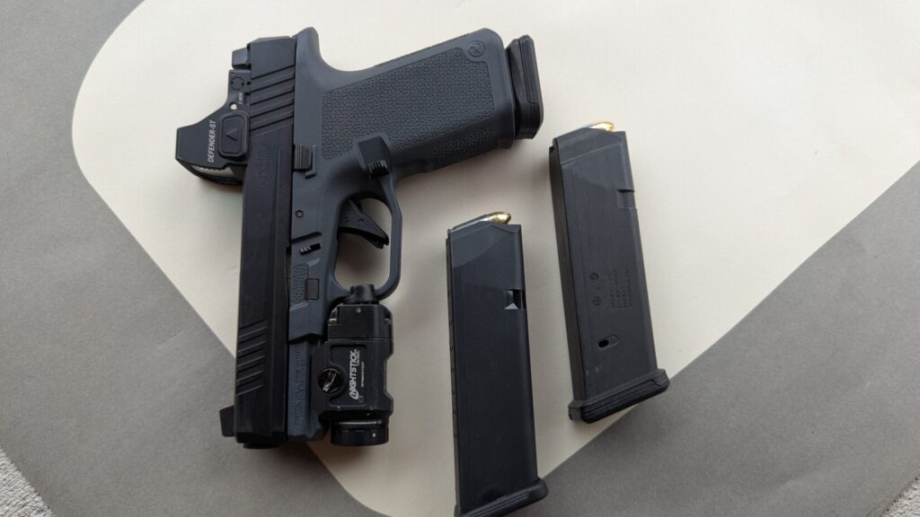 semiautomatic handgun with two loaded magazines