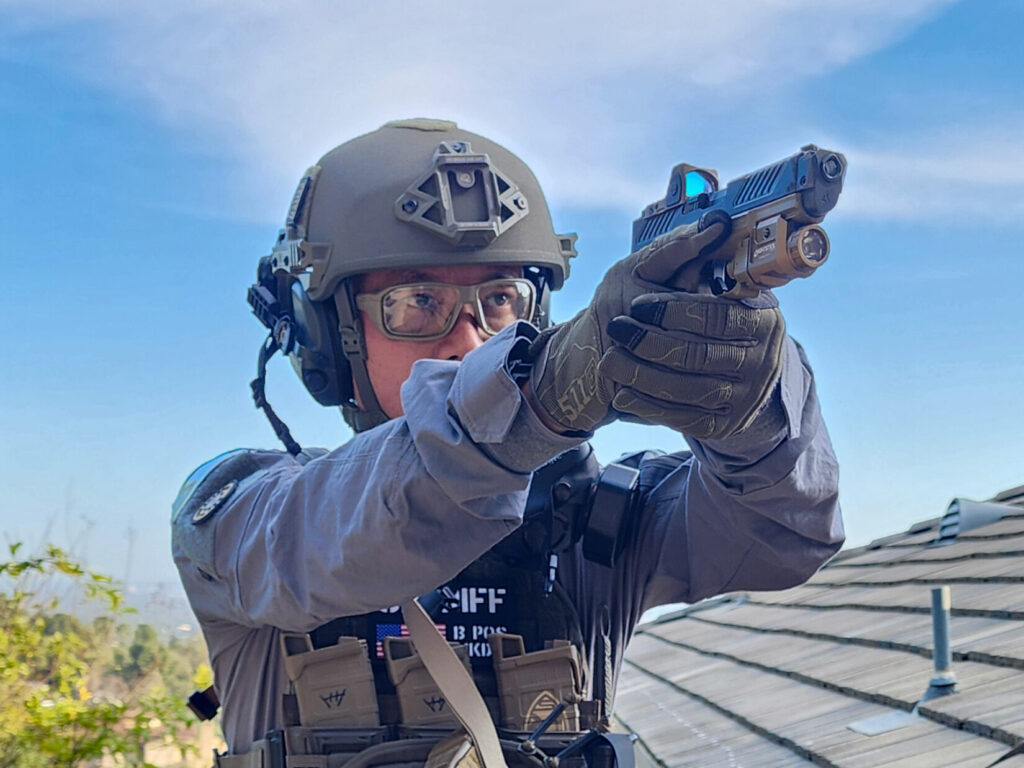Fifty Shades of FDE holding a Shadow Systems MR918 fitted with the Radian Afterburner + Ramjet.