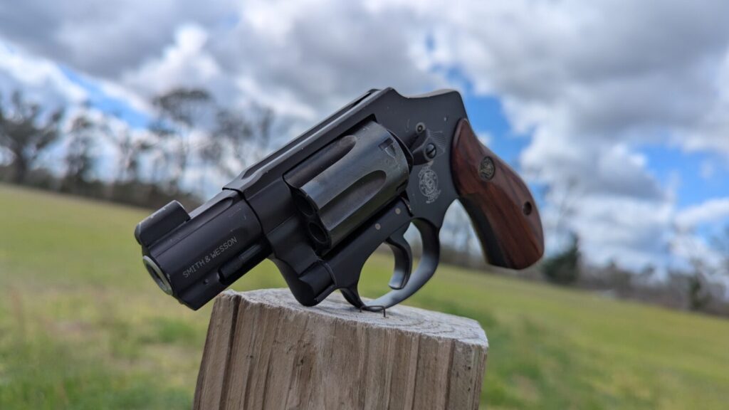 S&W 432 PD propped on a post