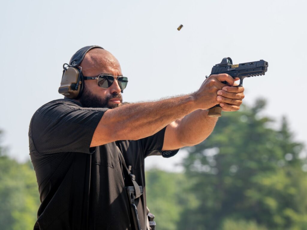 man shooting a sig sauer handgun