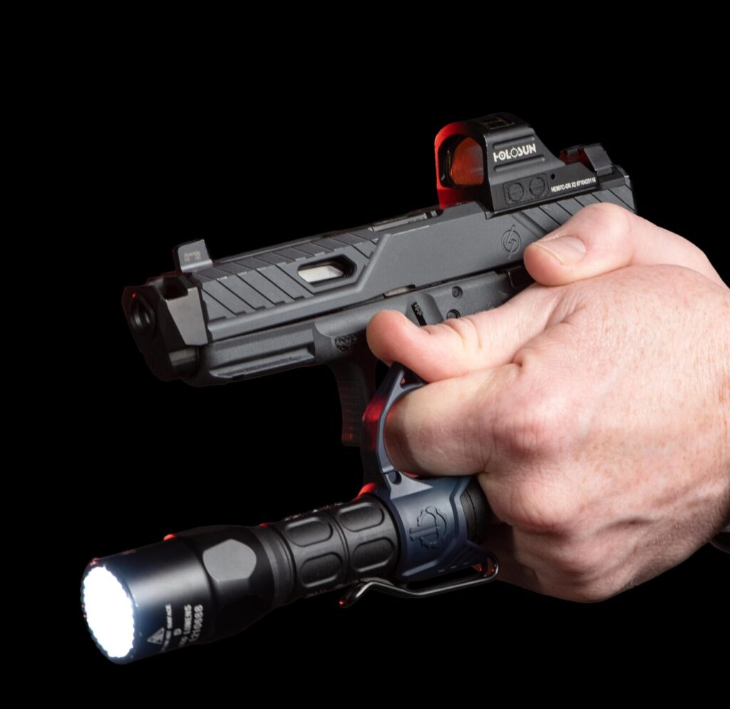 photo demonstrating the SwitchBack Technique of flashlight management while gripping a handgun