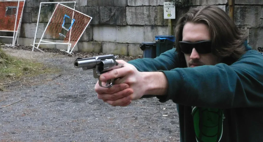 man firing a revolver