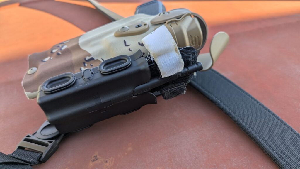 Safariland TQ Pouch mounted on duty holster for quick tourniquet access