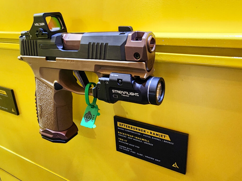 A Sig P365 fitted with the Radian Afterburner + Ramjet, displayed at the Radian Weapons SHOT Show 2024 booth