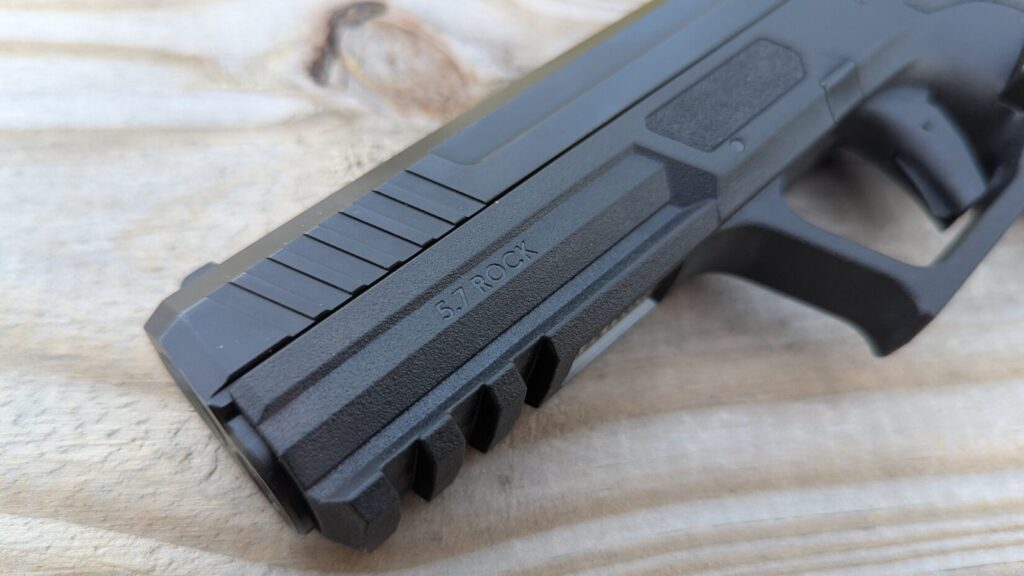 closeup of PSA 5.7 Rock slide, frame engraving, and Picattiny rail