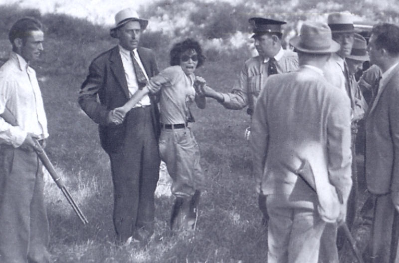 The capture of Blanche Barrow, sister-in-law of clyde barrow and a member of the barrow gang, circa 1933. The man on the left is carrying a winchester lever action.