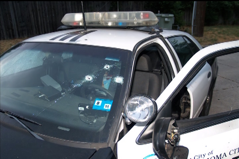 Bullet holes seen in windshield of patrol car from Oklahoma City Police