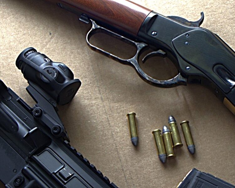 ar-15 and winchester 1873 rifles