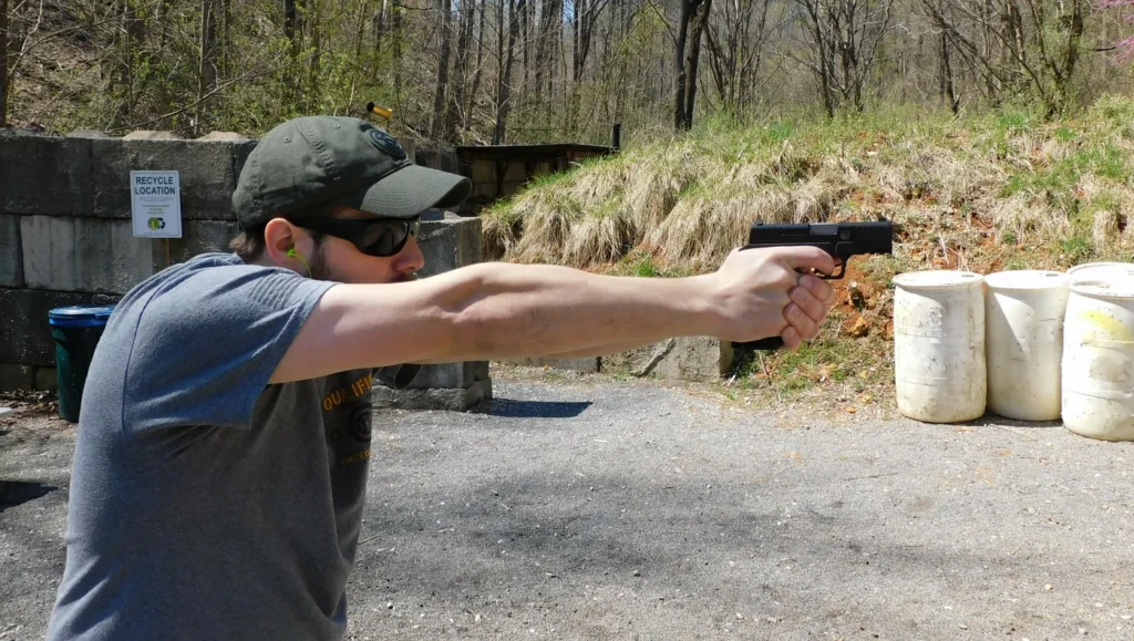 Man firing semi-automatic pistol