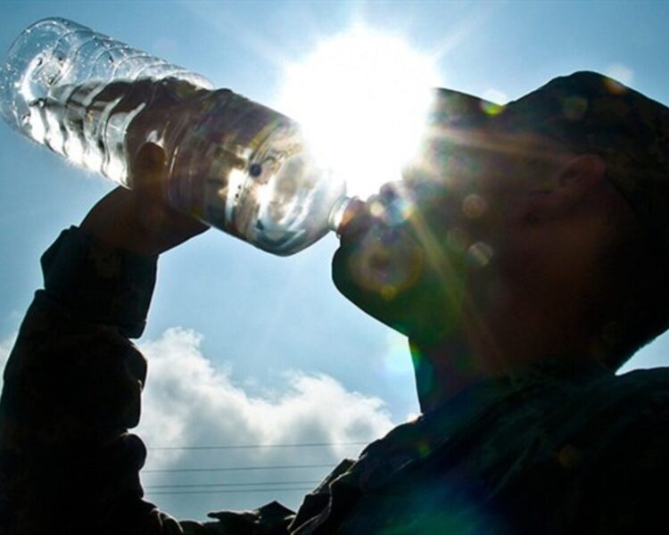 soldier drinking water from bottle