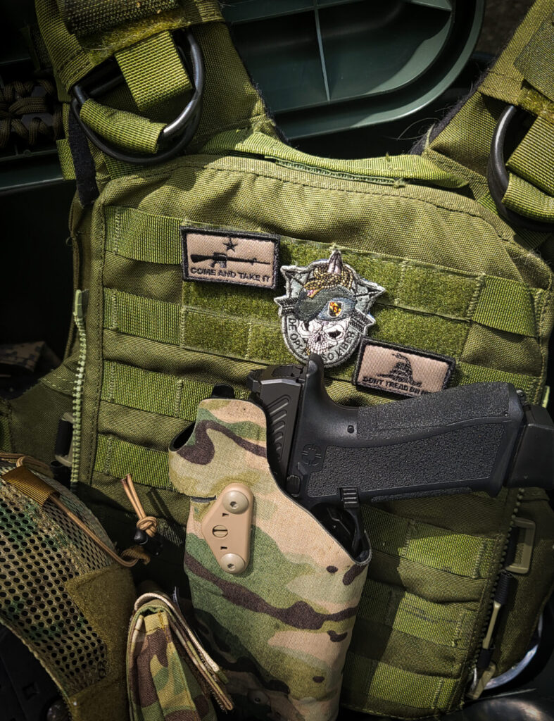 6354DO with handgun and chest rig