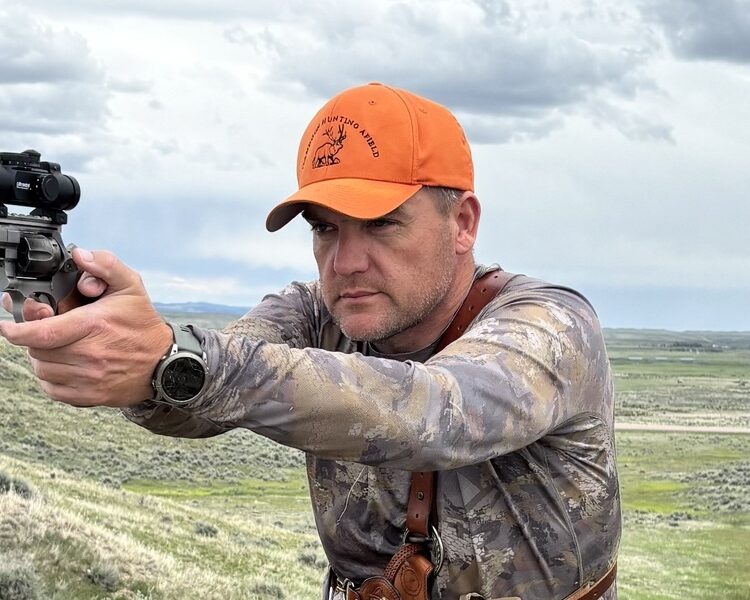 Chris Rhodes with a Spohr Revolver and Red dot hunting.