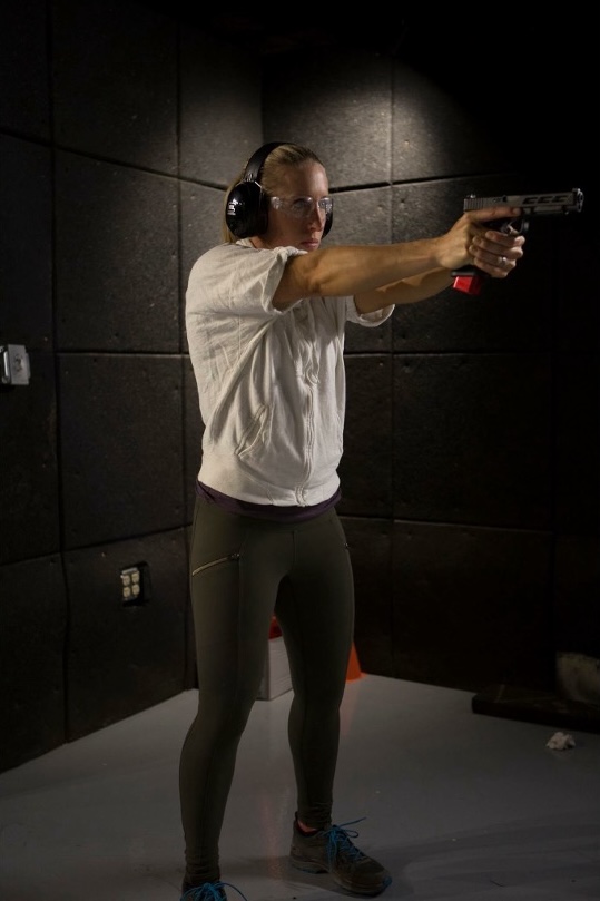 Lanny Barnes aiming a pistol