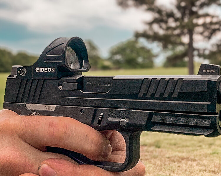 man shooting Ruger RXM for review