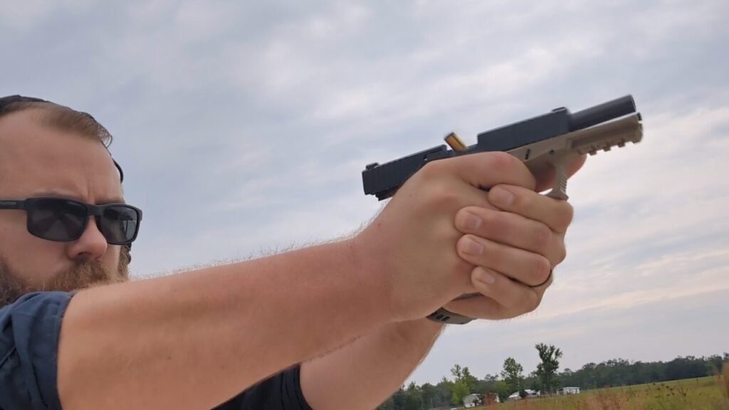 man shooting Grand power p1 mk 12