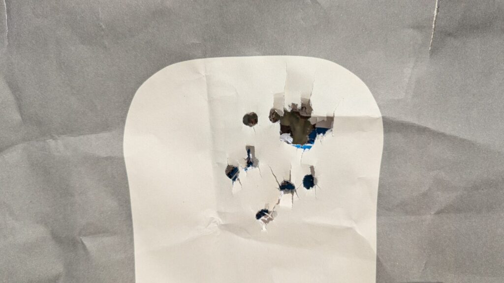 Seven yard buckshot pattern in head of FBI Q target